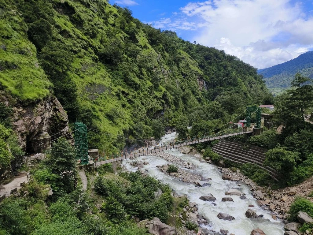 Rudranath Trek trail with breathtaking alpine meadows, rolling hills, and panoramic Himalayan mountain views