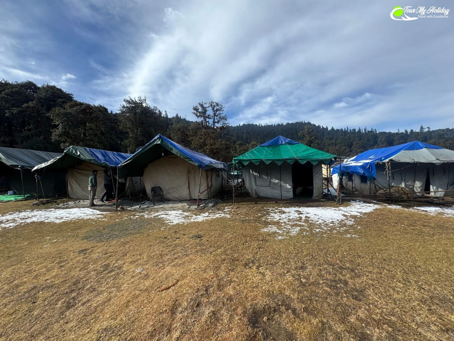 Scenic view of Chopta camps in Uttarakhand with campers enjoying nature and panoramic mountain landscape