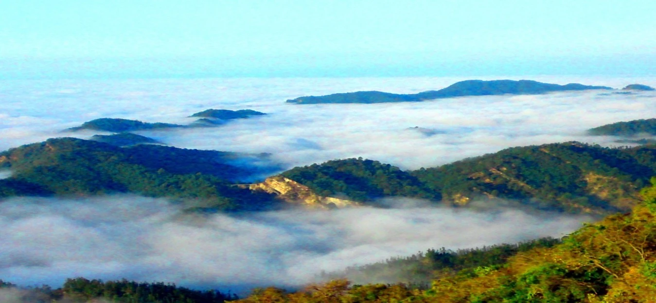 Beautiful Mussoorie hill station view with clouds and green mountains